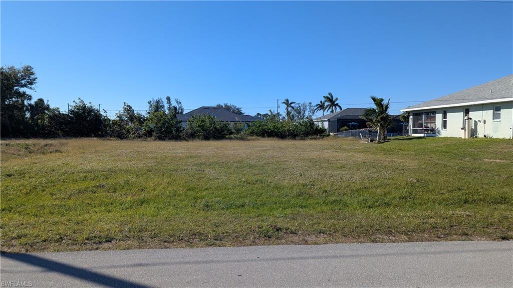 a view of a big yard with a house