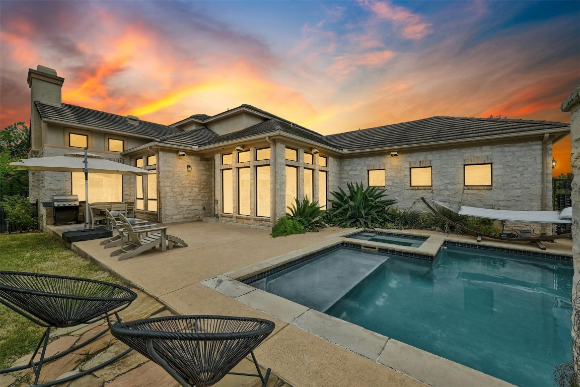 a view of a house with pool table and chairs