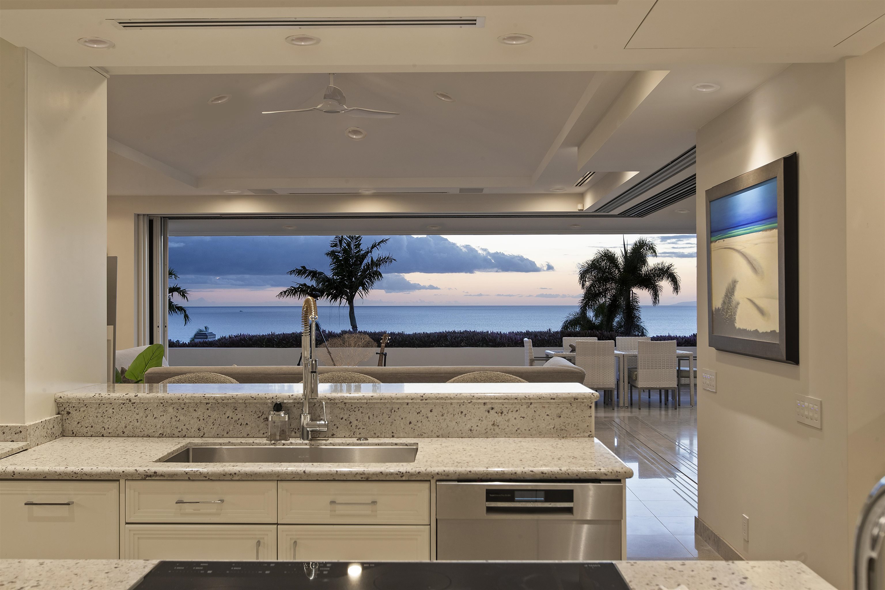 a kitchen with a sink and a refrigerator