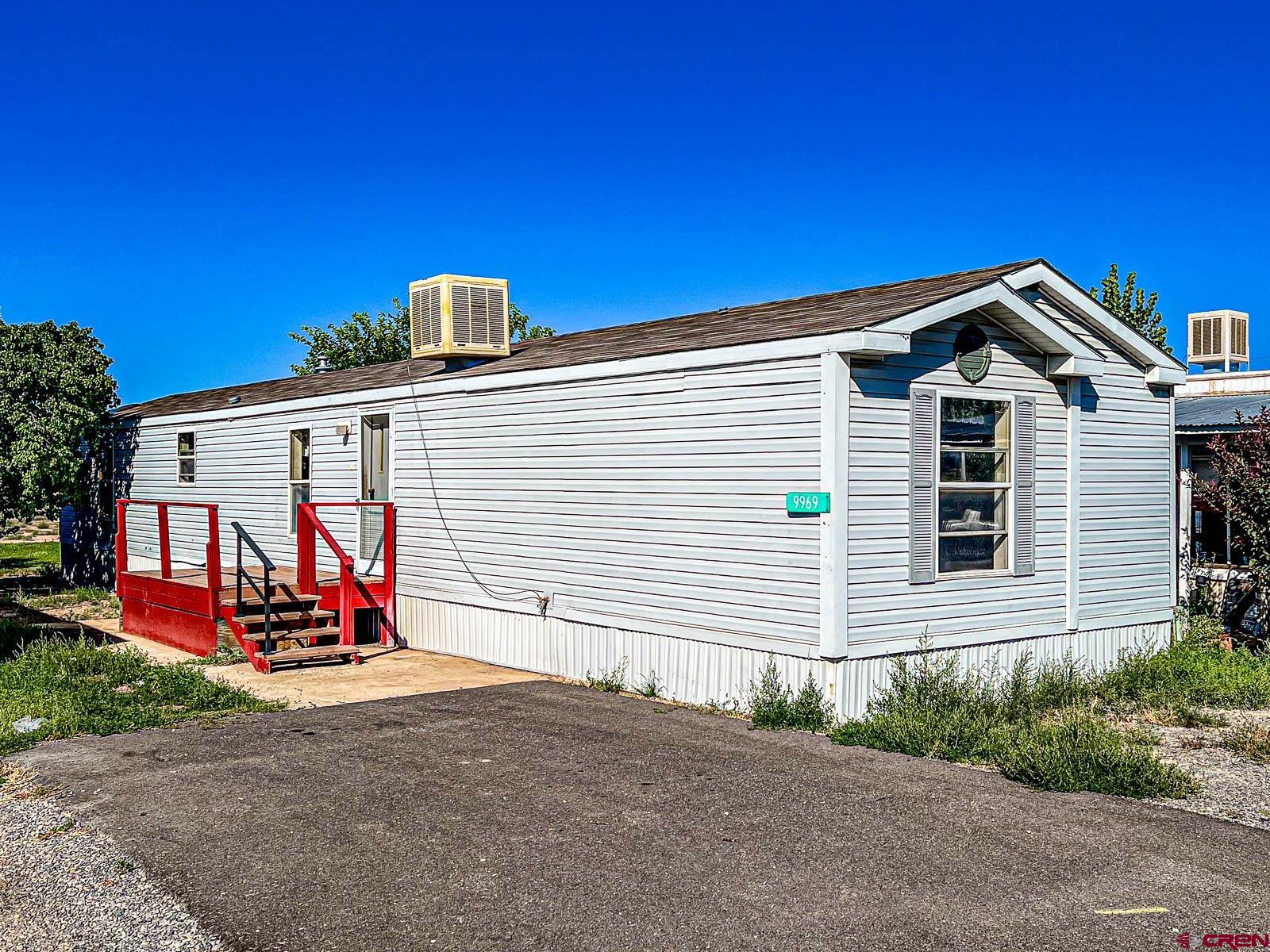 a view of a house with wooden deck