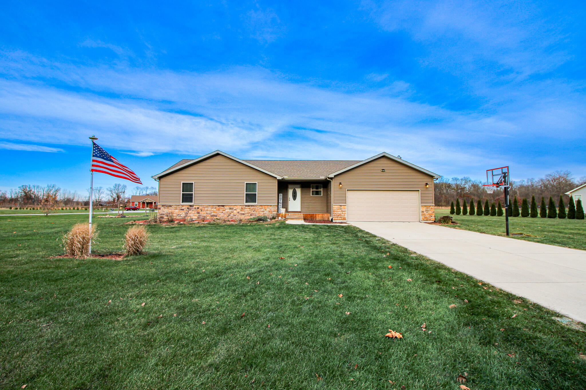 a view of house with backyard