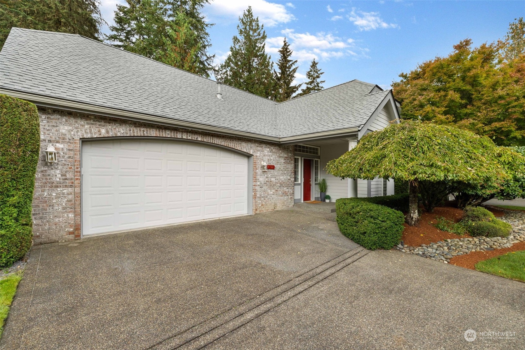 a front view of a house with a garage