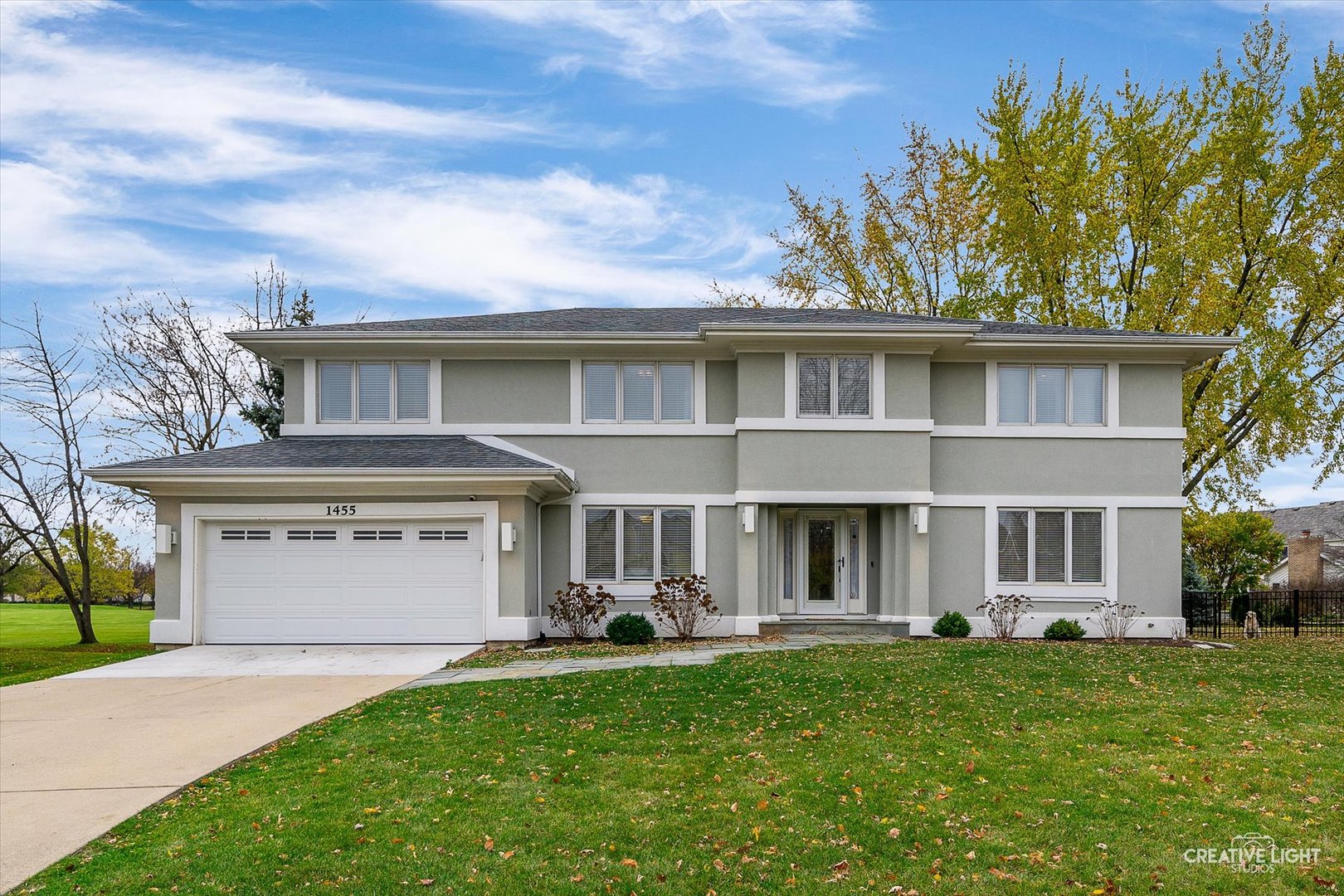 a front view of a house with a yard