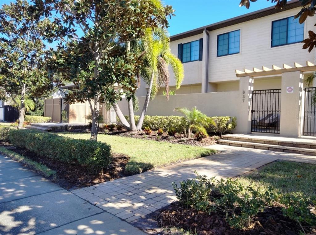 a view of a backyard of the house