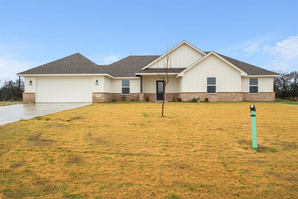 a view of a house with a yard and swimming pool