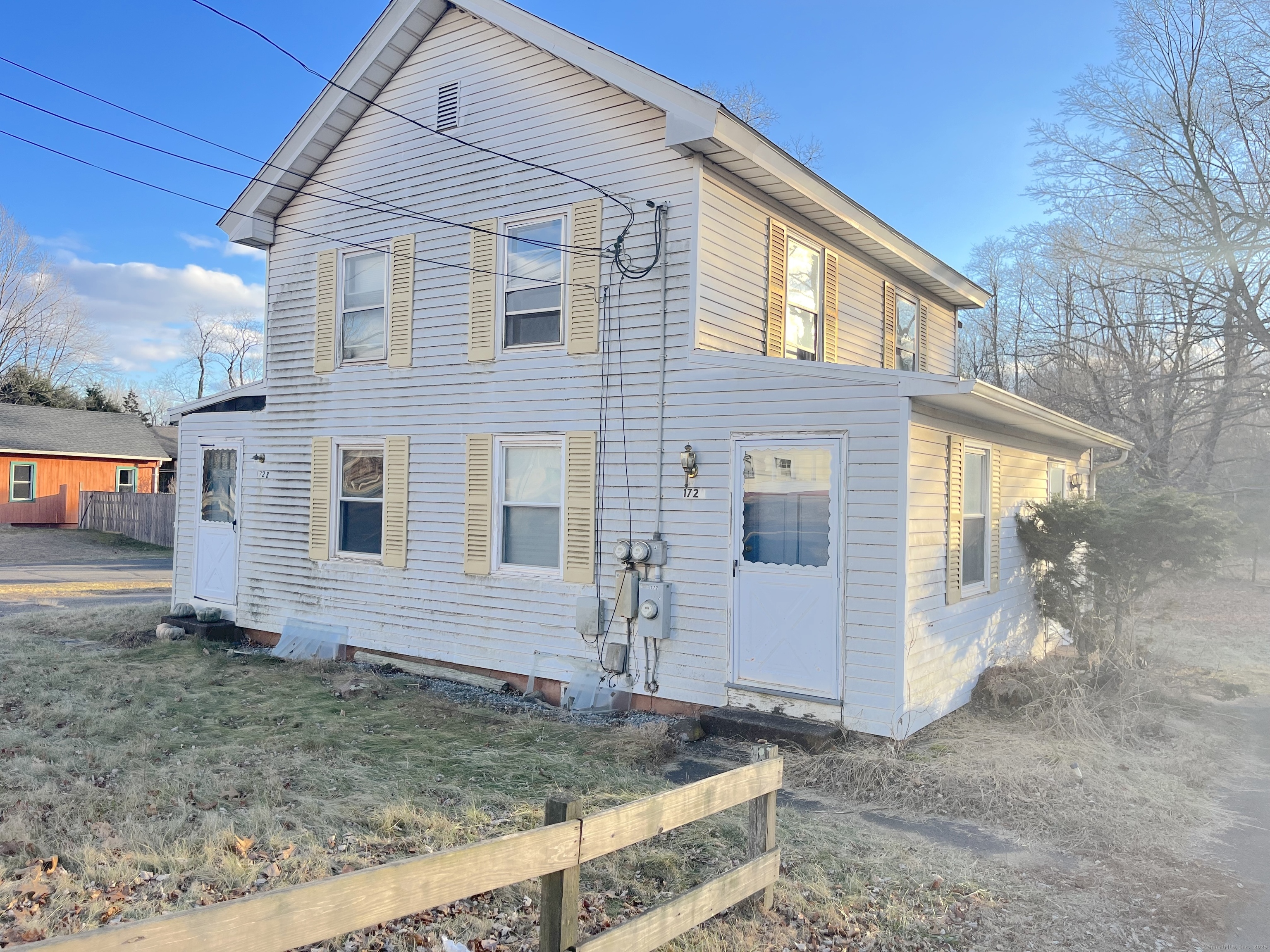 a view of a house with a yard