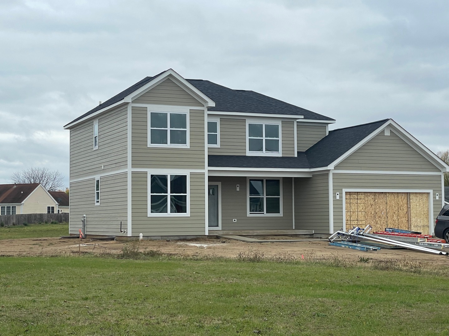 a front view of a house with a yard