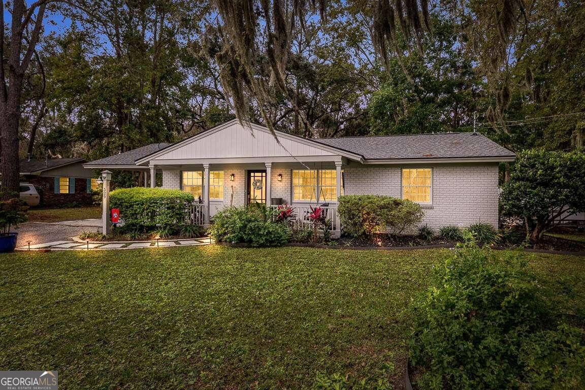 a front view of a house with a yard