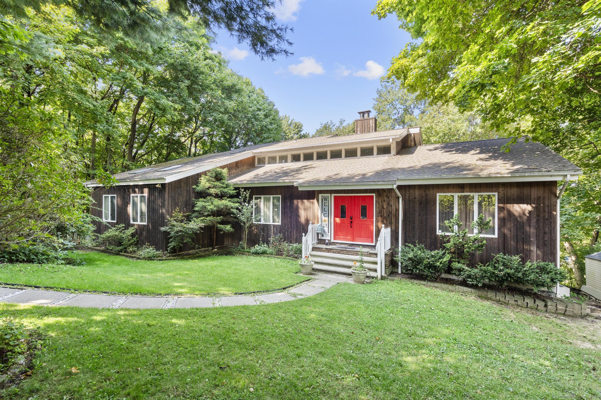 a front view of a house with garden