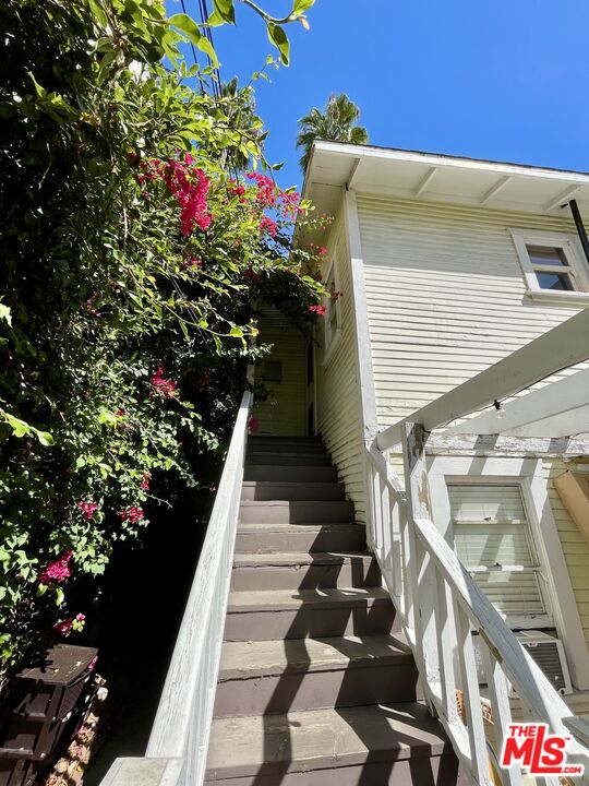 a view of entryway with flower pots