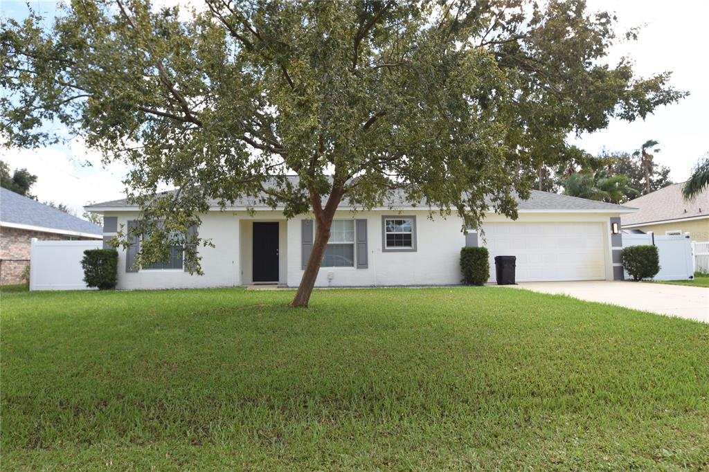 front view of a house with a yard