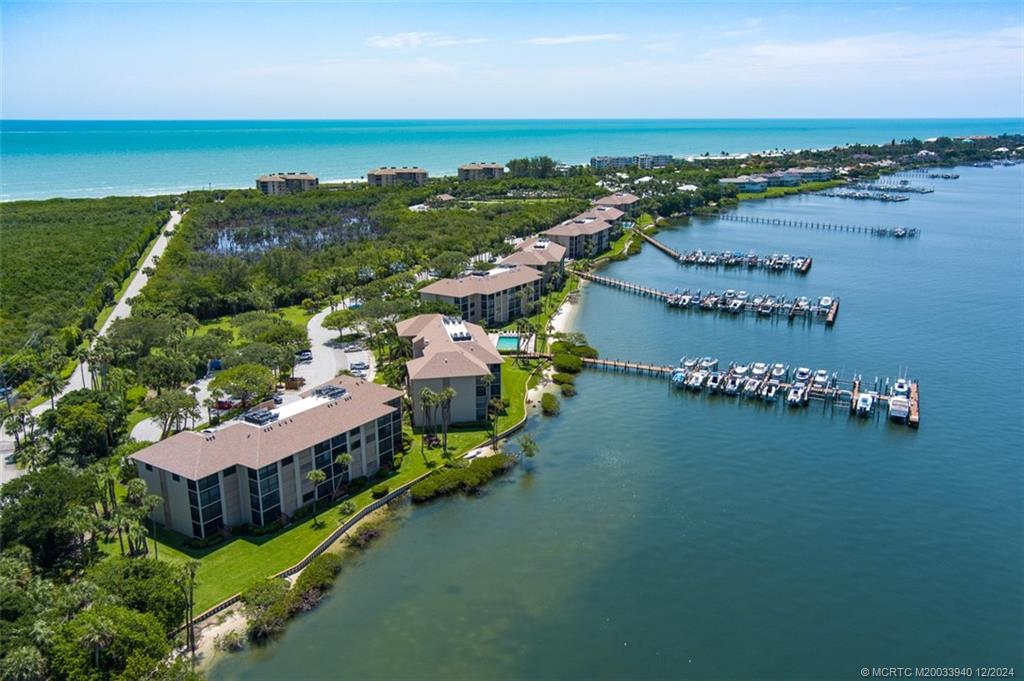 an aerial view of a house with a lake view