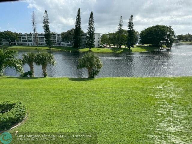 a view of a lake with a yard