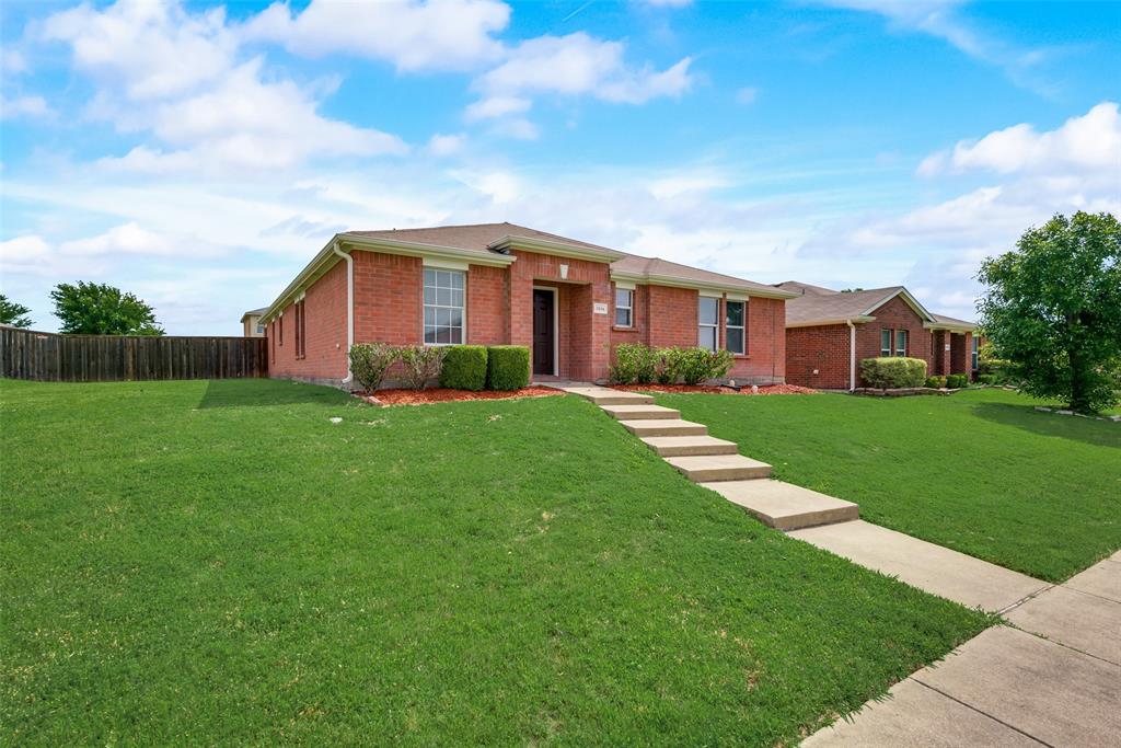 a view of a house with a big yard