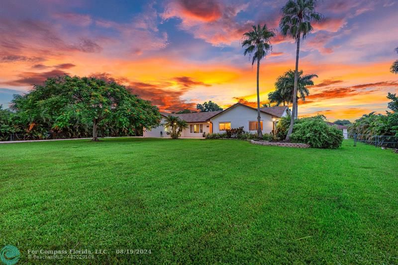 a view of a house with a big yard