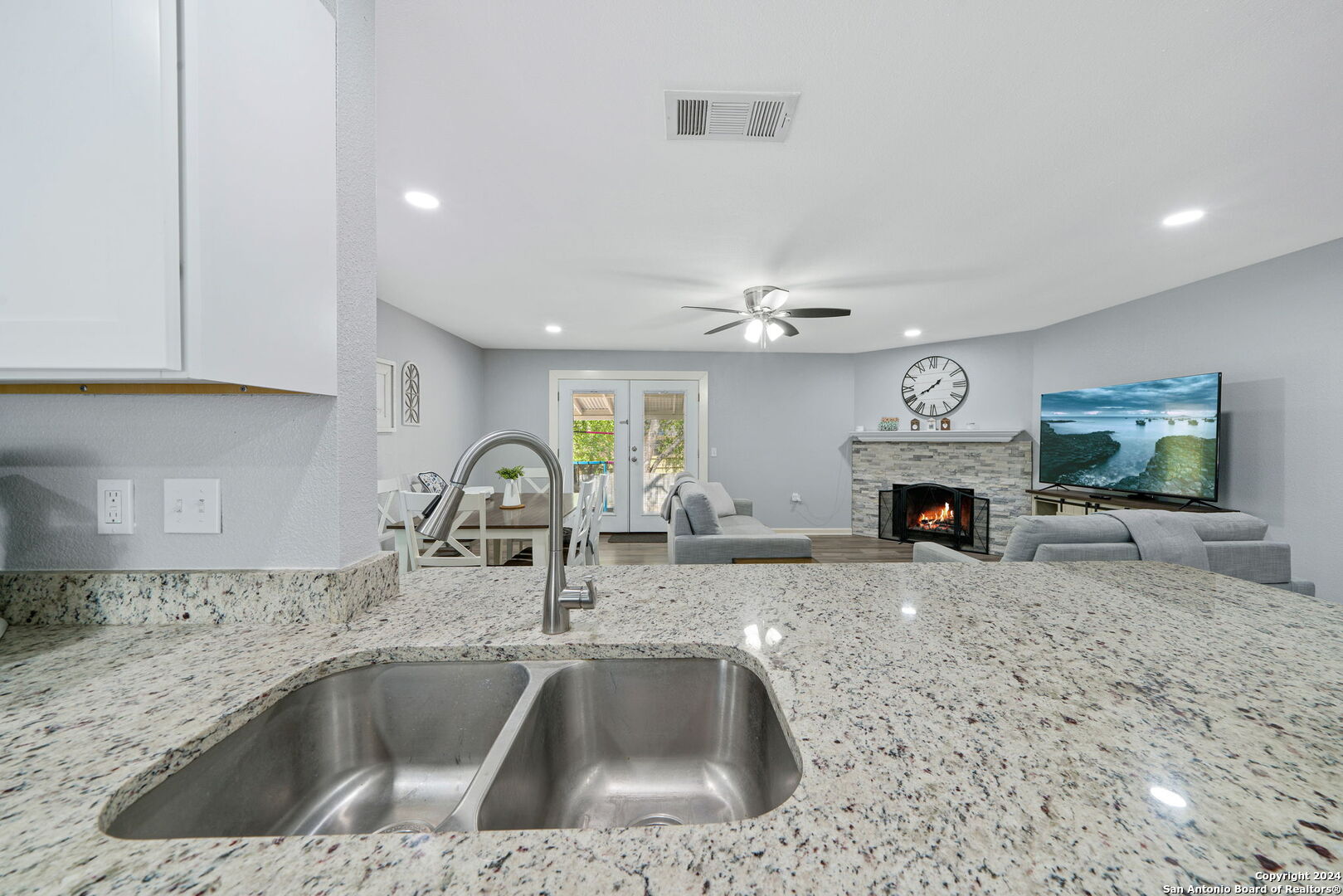 a kitchen with a sink and a counter top space