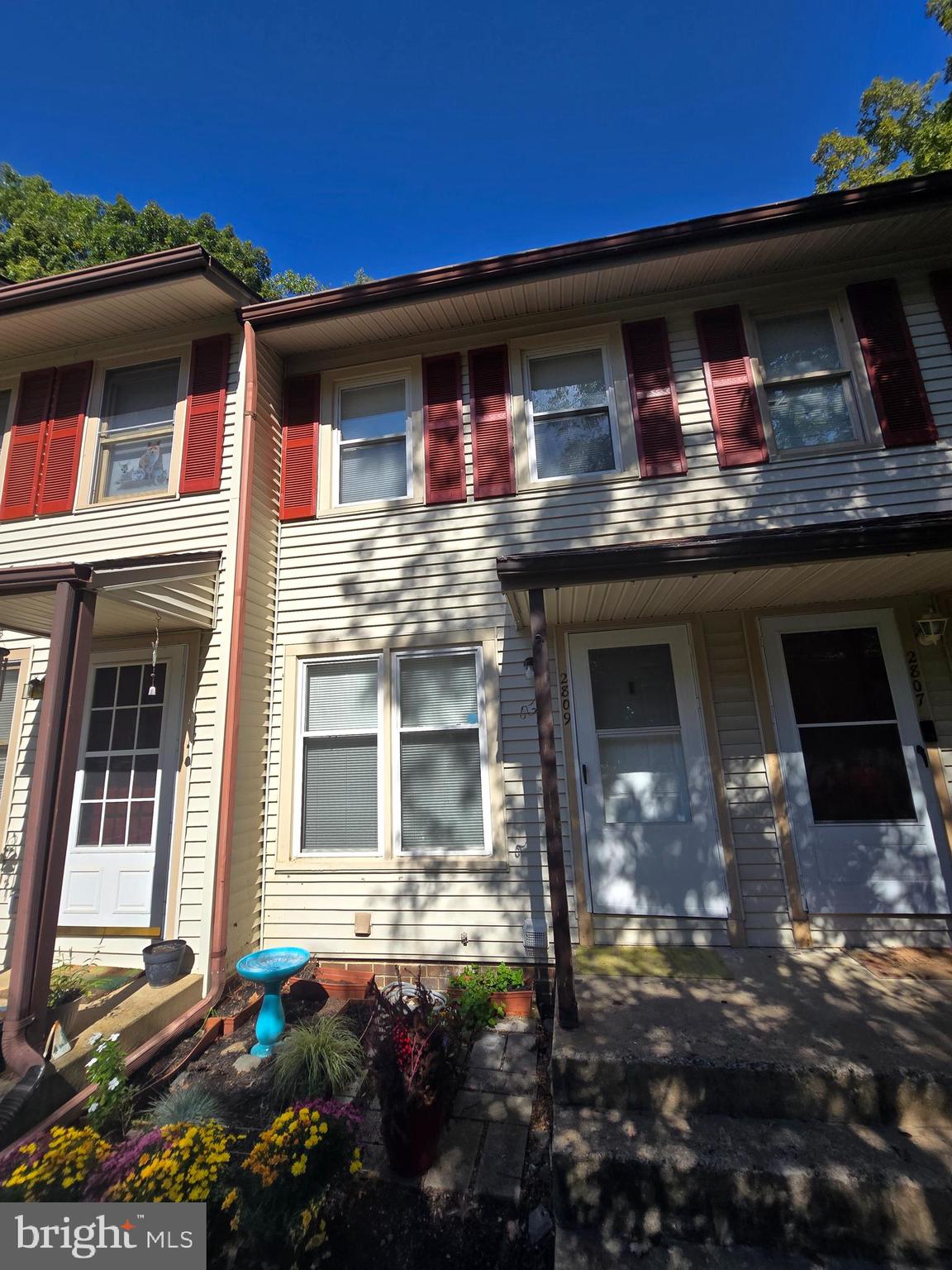 a front view of a house with yard