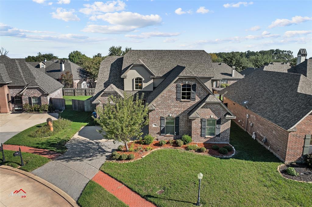 an aerial view of a house with garden