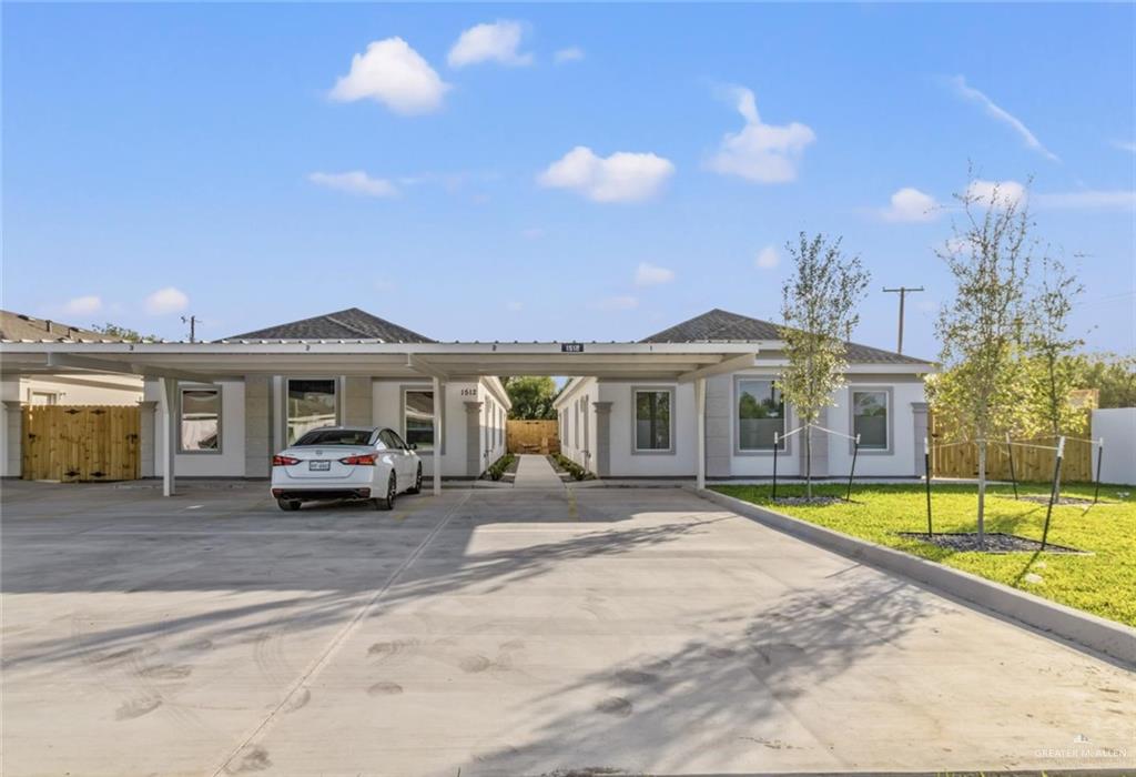 a view of house with outdoor space and swimming pool