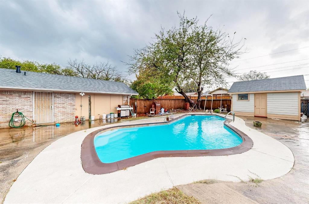 swimming pool view with a outdoor seating