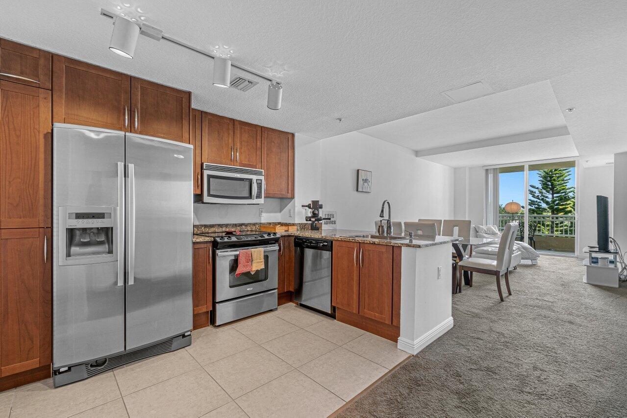 a kitchen with cabinets and stainless steel appliances