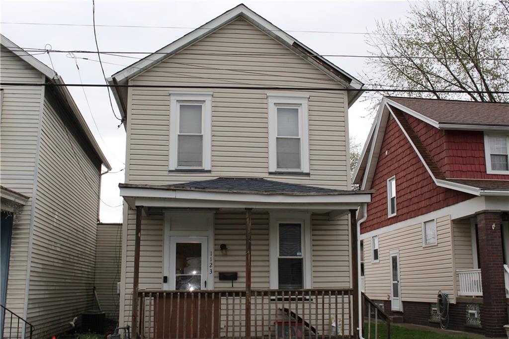 a view of a house with iron stairs