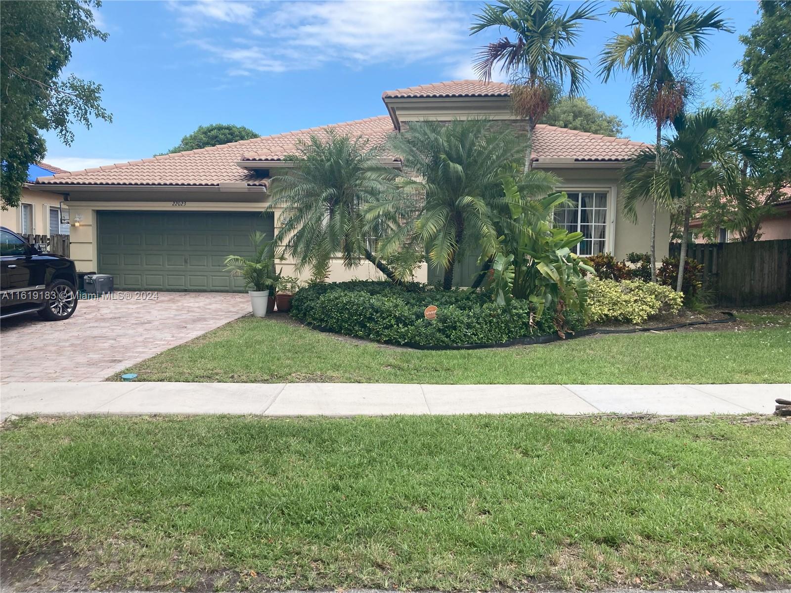 a view of a house with a garden