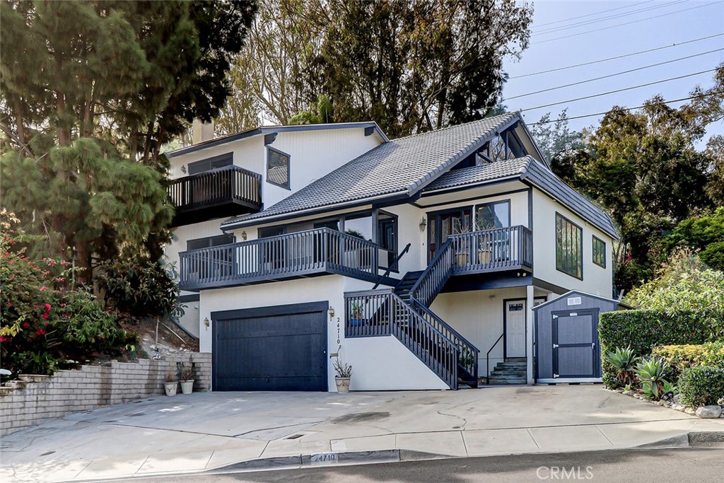 a front view of a house with garage