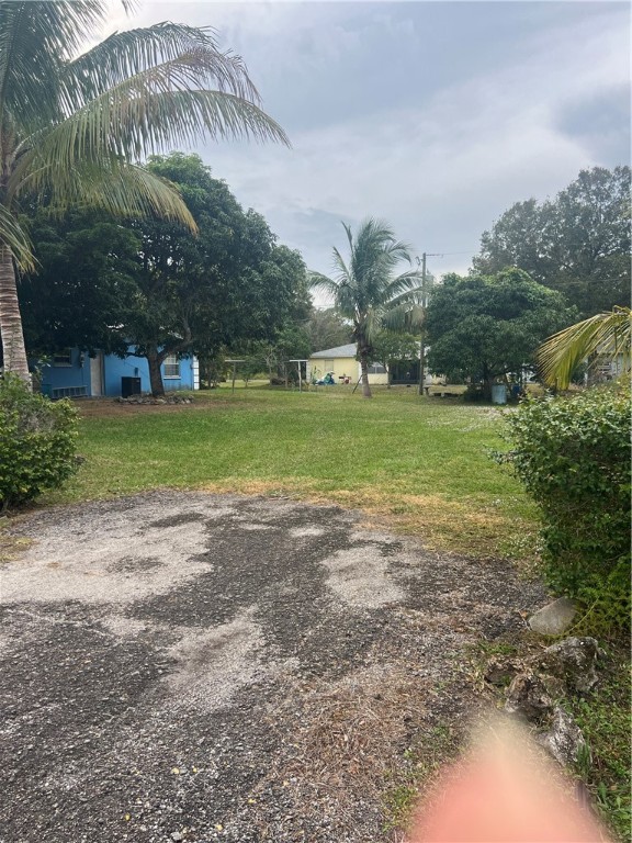 a view of a big yard with a house