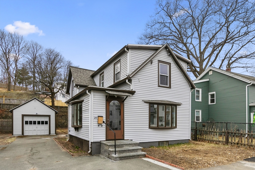 a front view of a house with garage