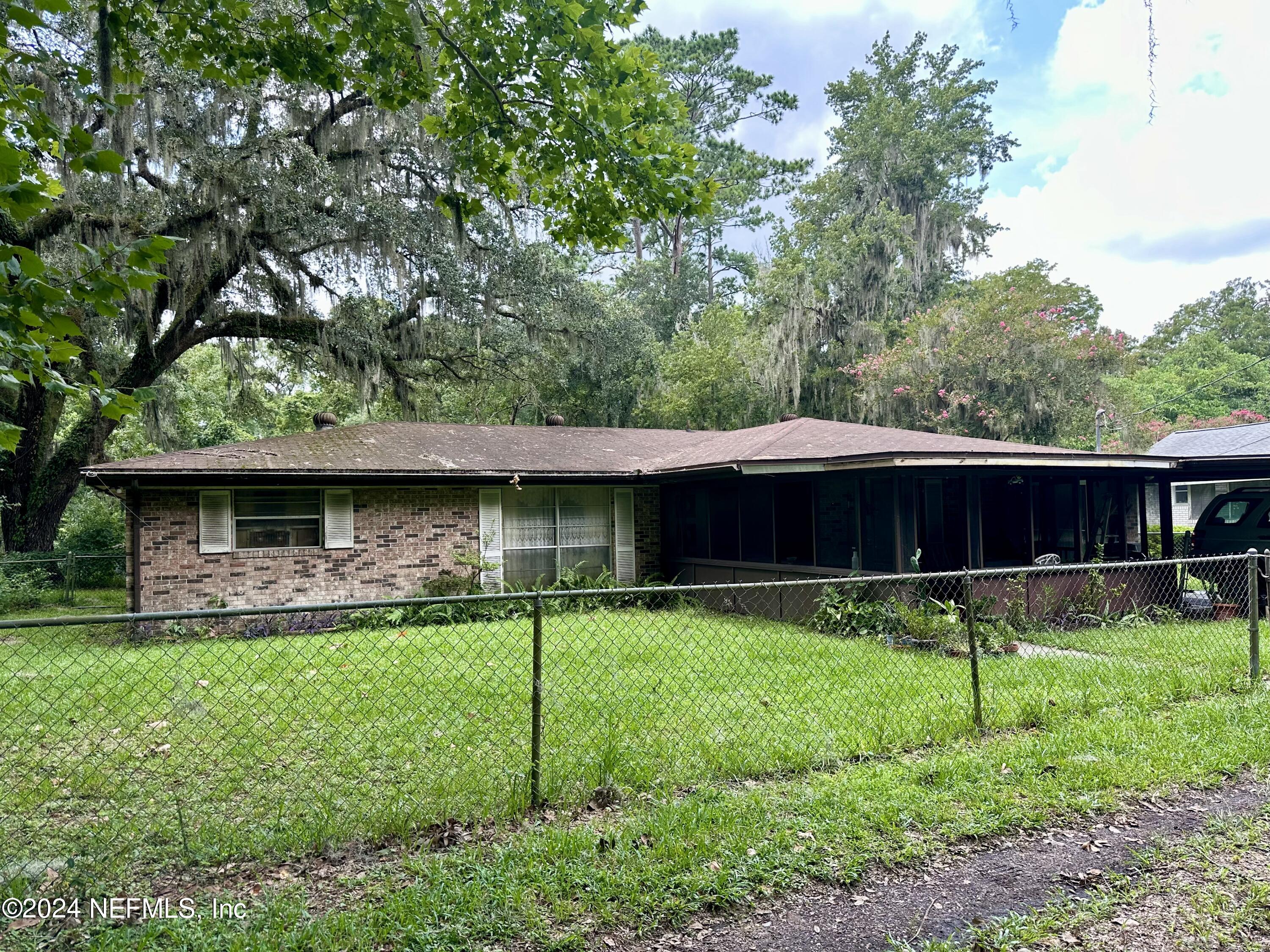 a backyard of a house with lots of green space