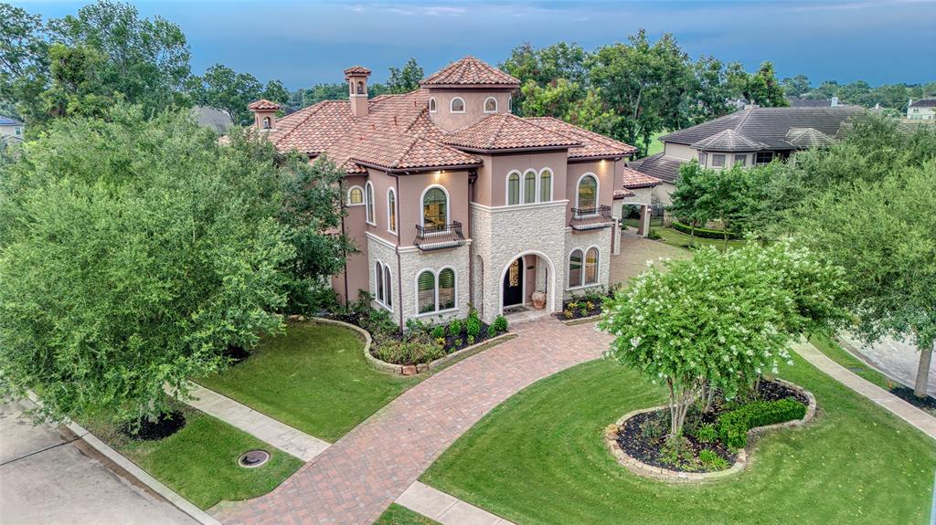 a aerial view of a house with a yard and plants