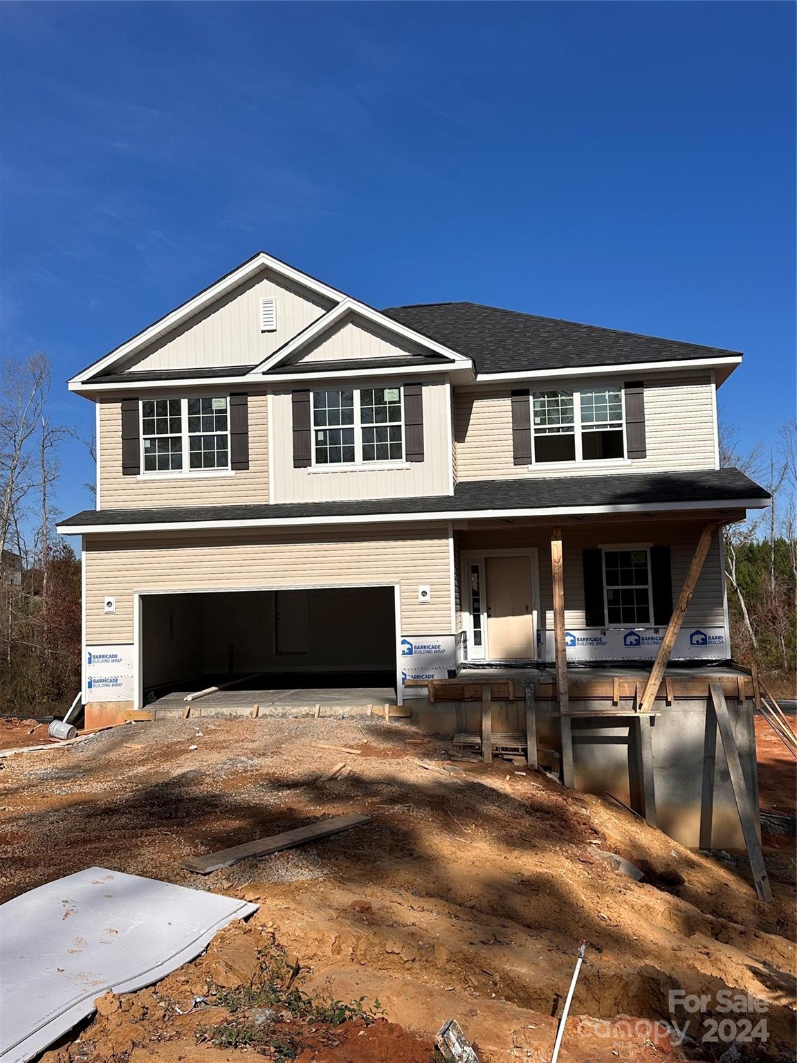 a front view of a house with yard