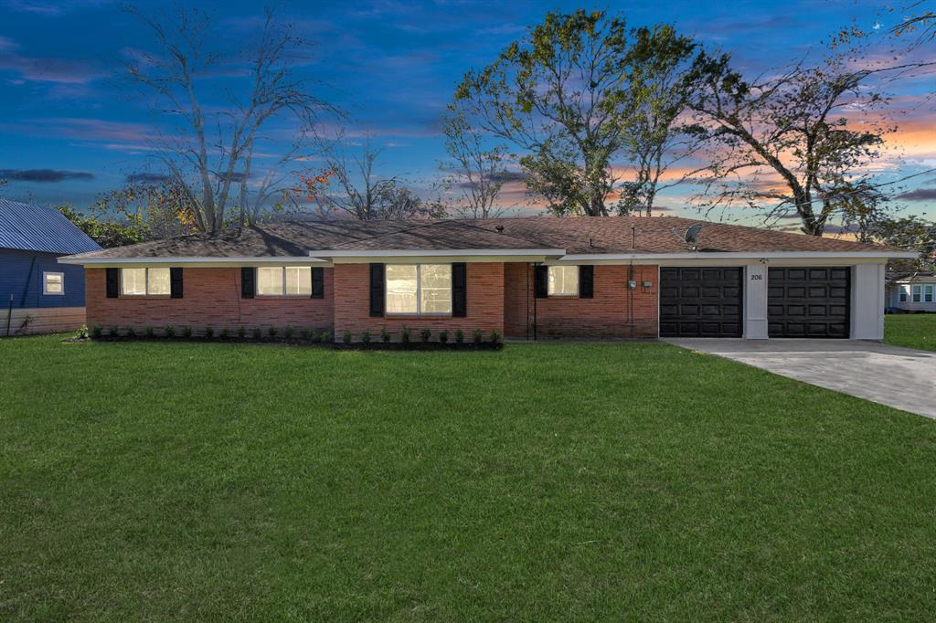 Welcome to 206 Hill St, a beautiful one-story brick home.