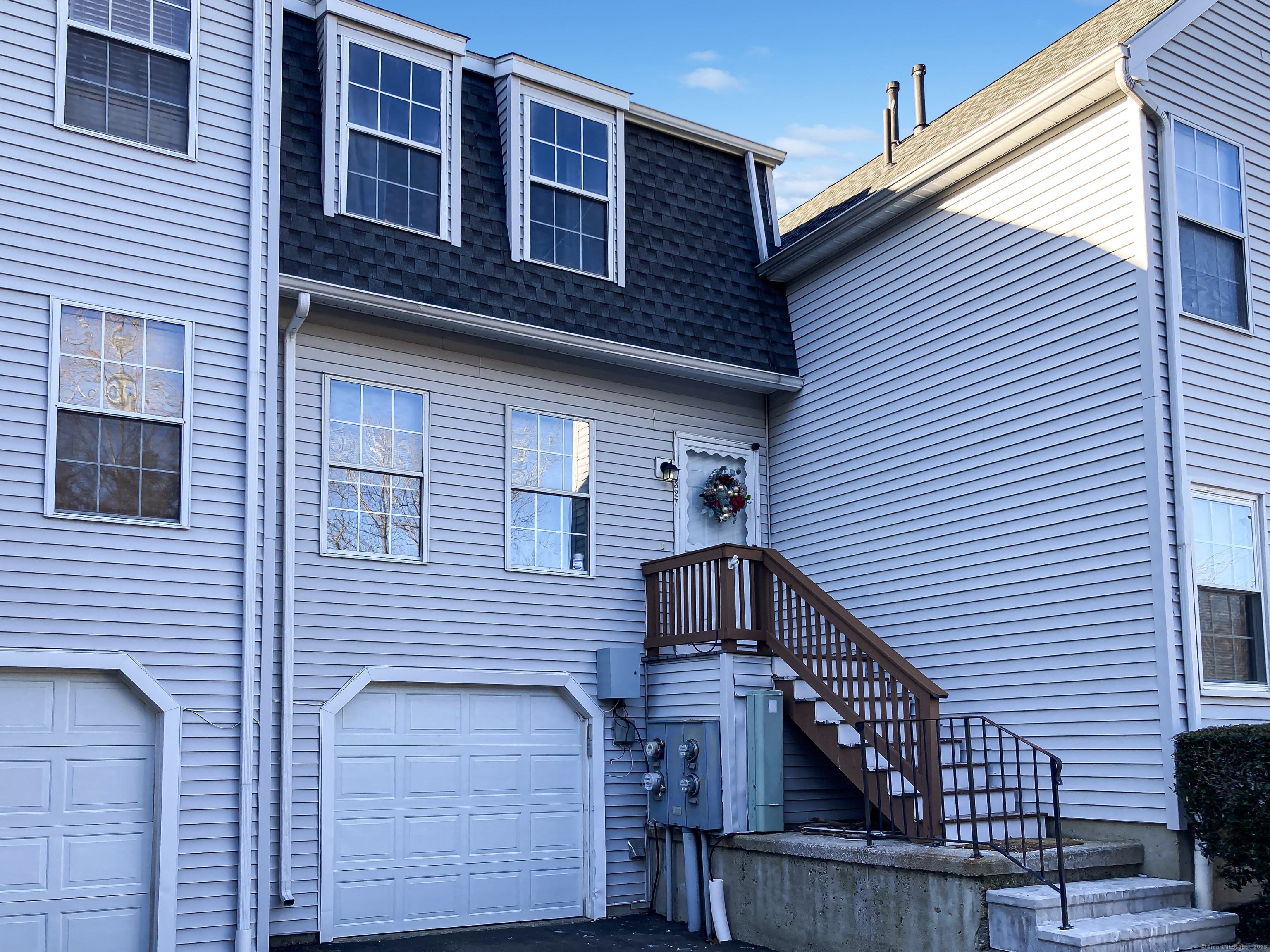 a front view of a house with a garage