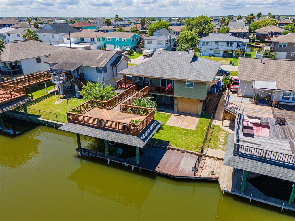 an aerial view of a house with a swimming pool patio and outdoor seating