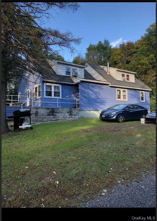 a view of a house with a backyard