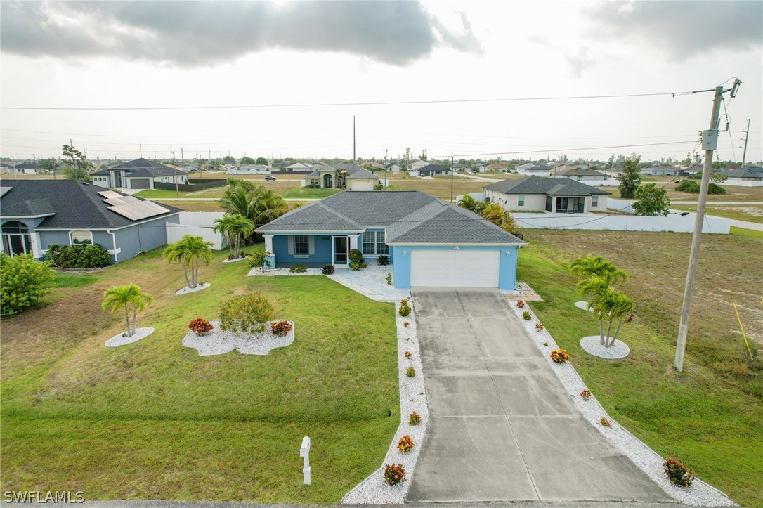 an aerial view of a house with outdoor space