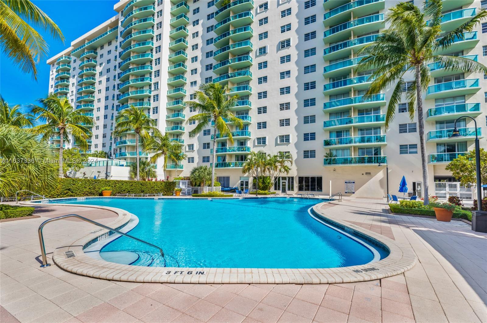 a view of swimming pool with outdoor seating