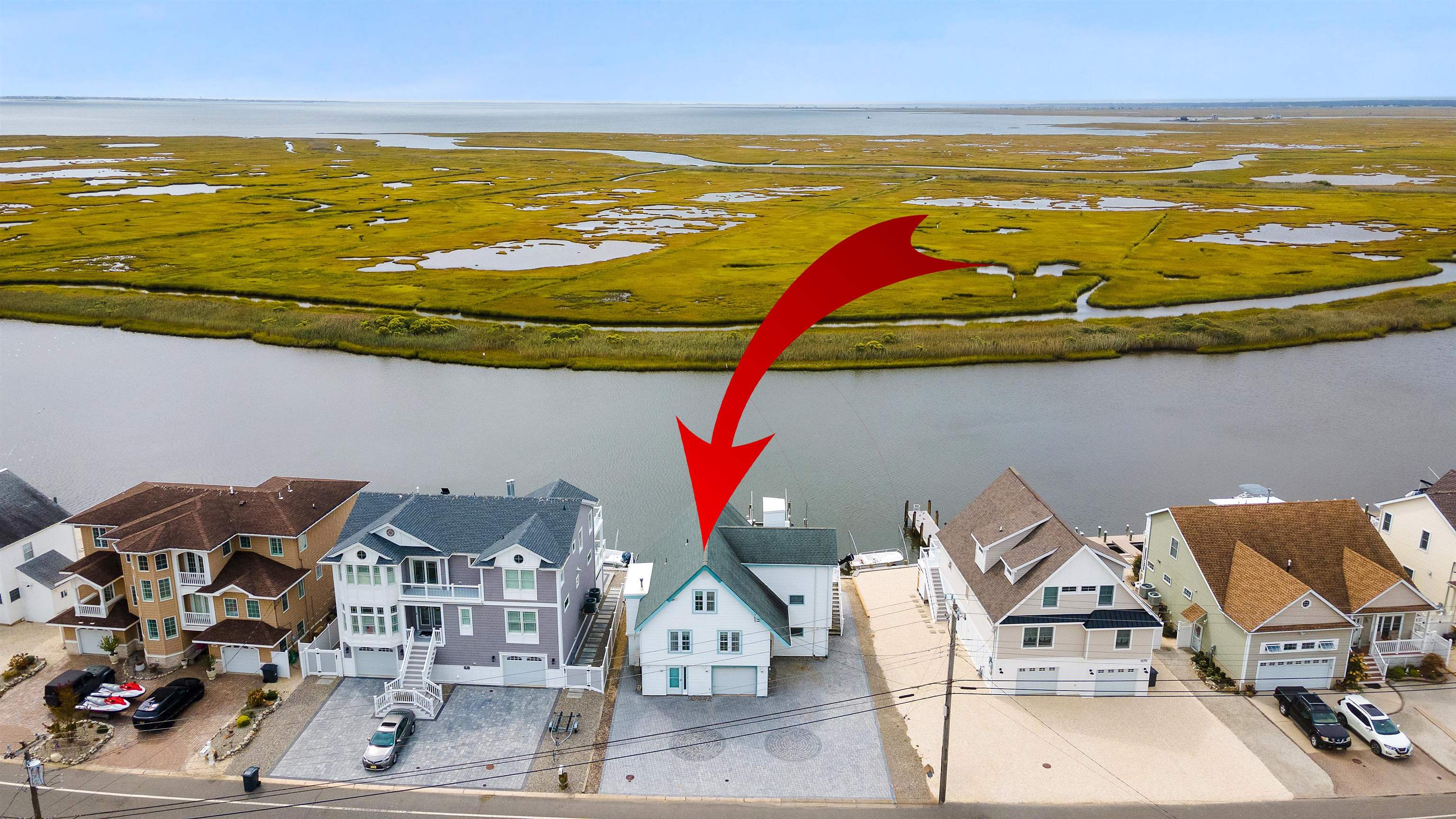 a view of an ocean and a houses