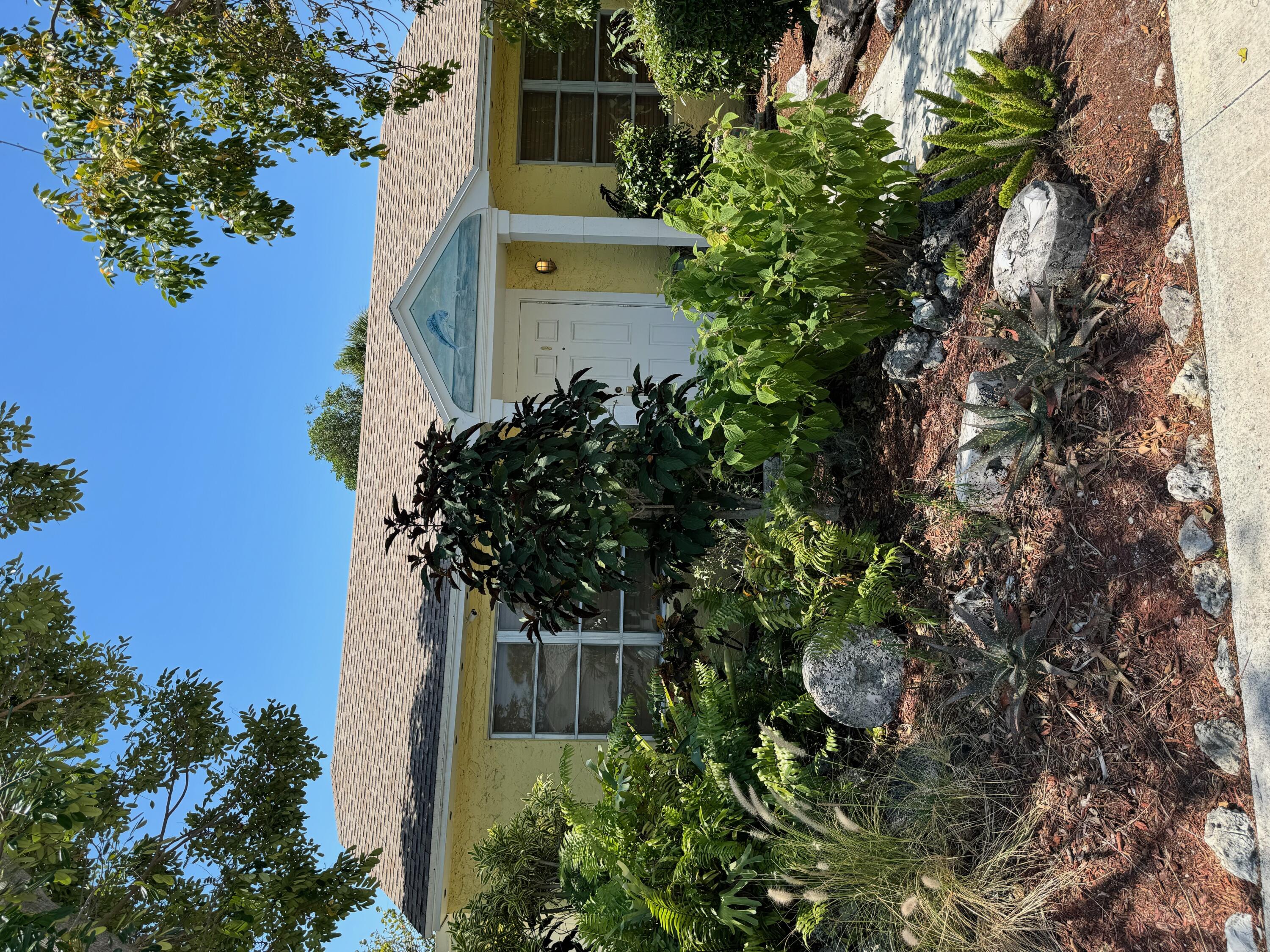 a view of a house with a garden