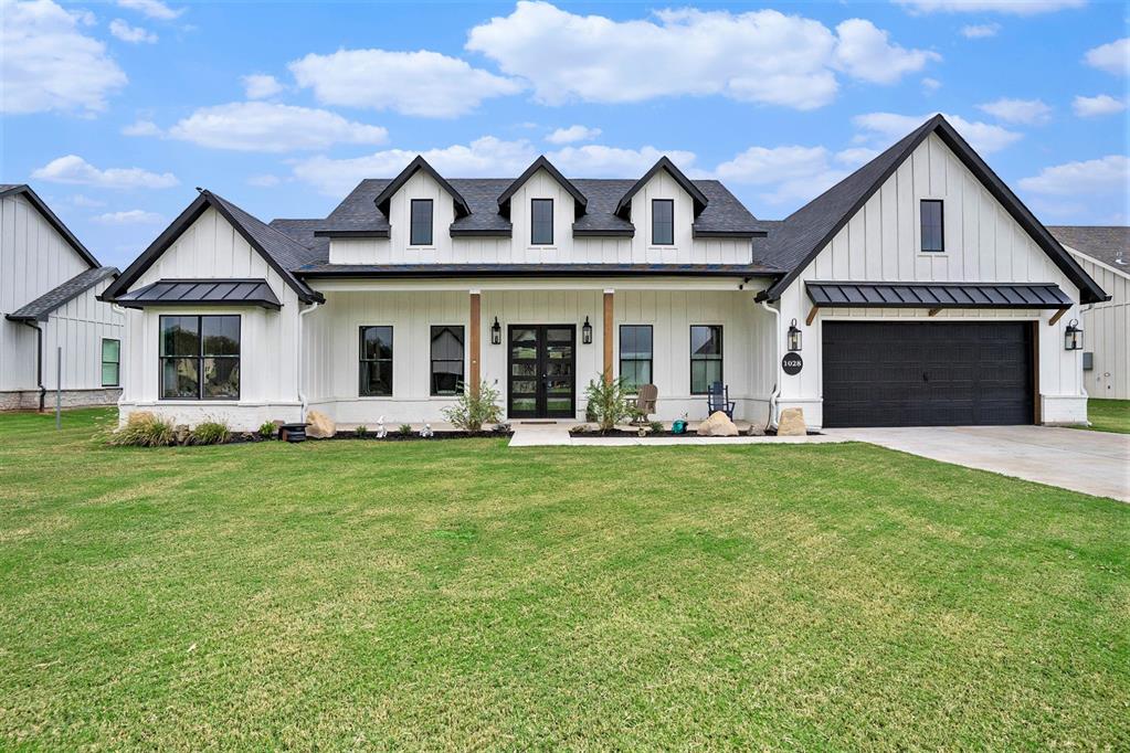 front view of a house with a garden