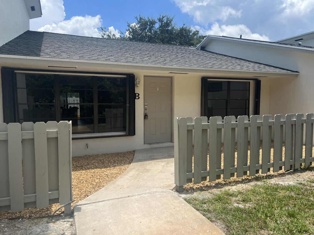 a front view of a house with a garage