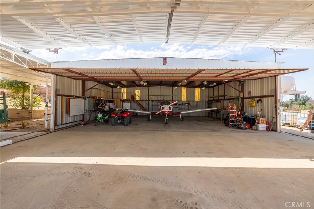 a view of a garage with parked cars