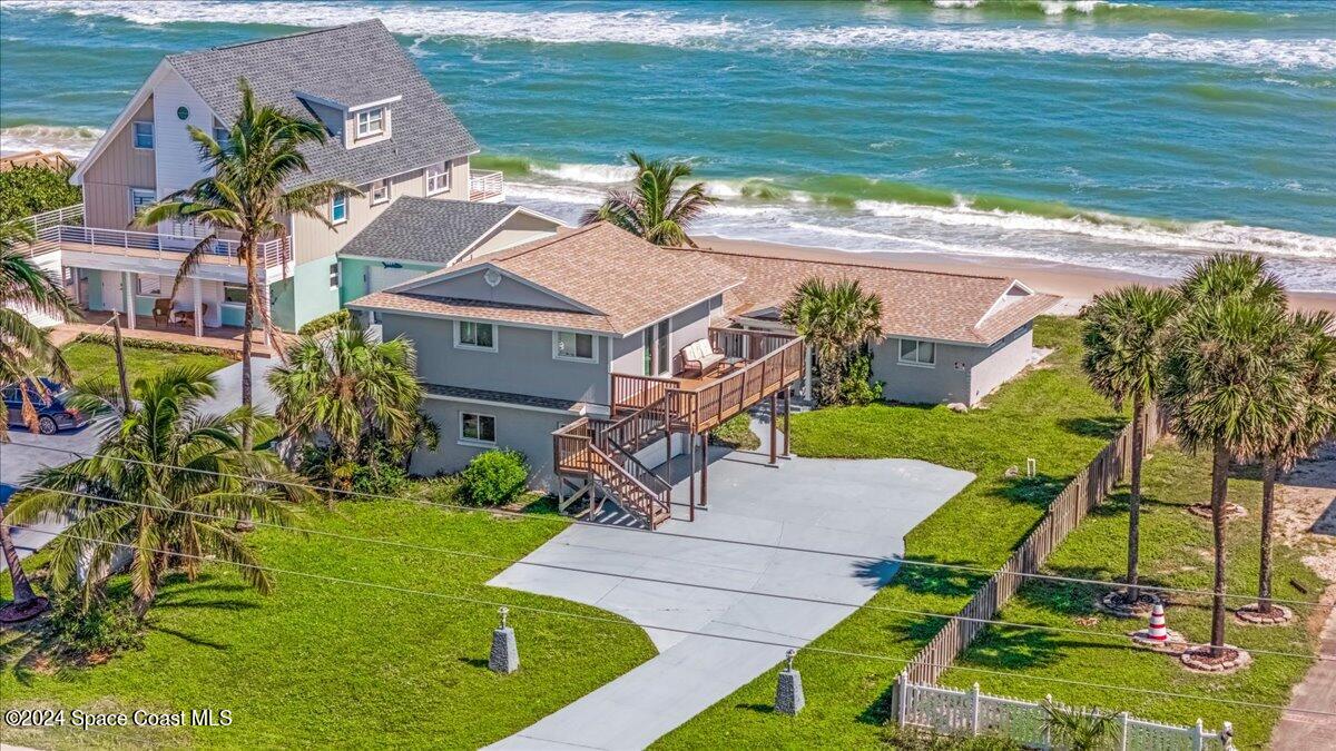 an aerial view of a house with a garden