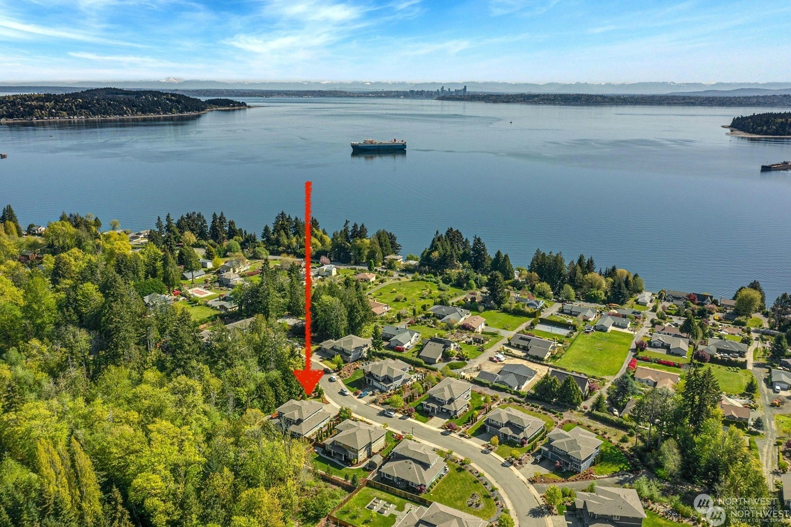 a view of a lake with a houses in the back