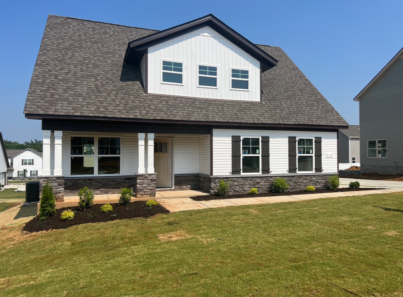 a front view of a house with garden