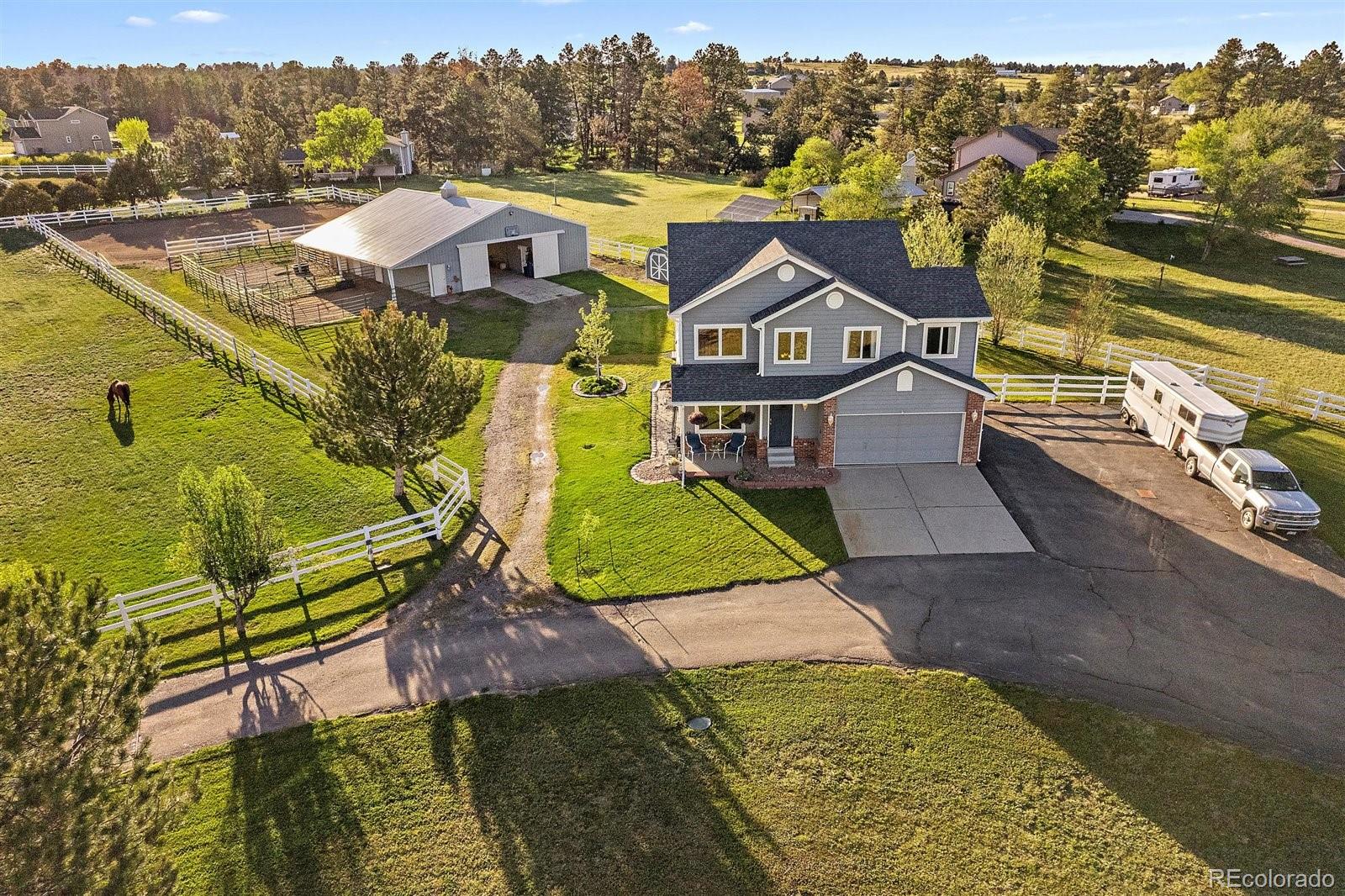 an aerial view of a house with a big yard