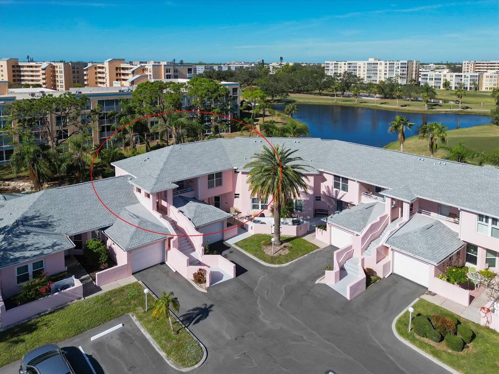 an aerial view of a house with outdoor seating