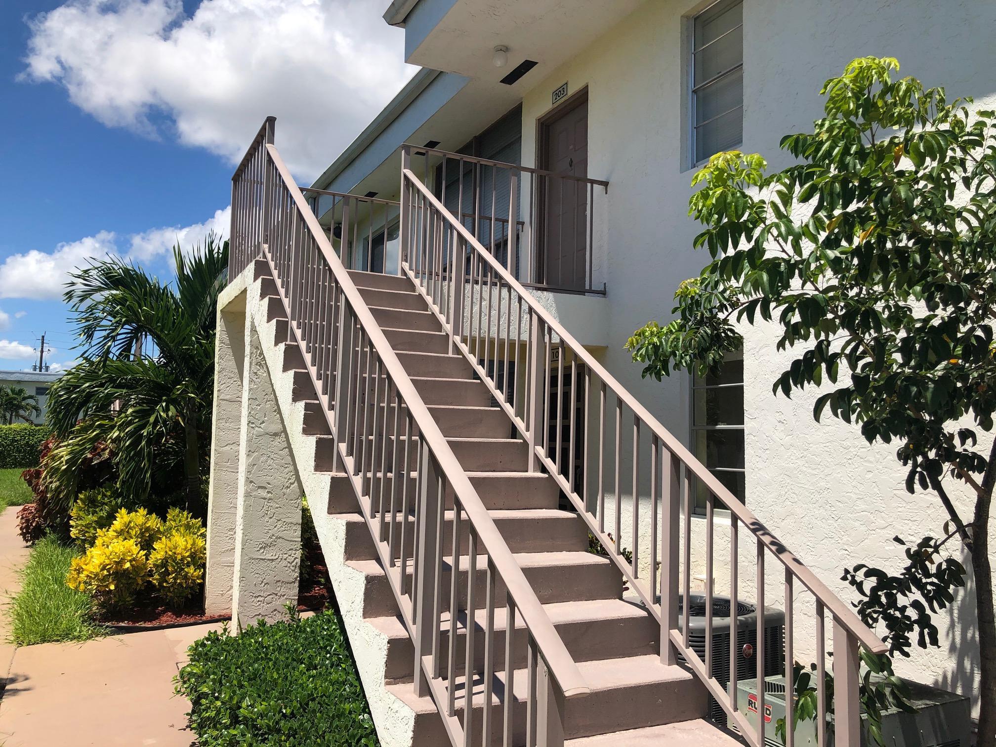 a view of entryway with wooden stairs